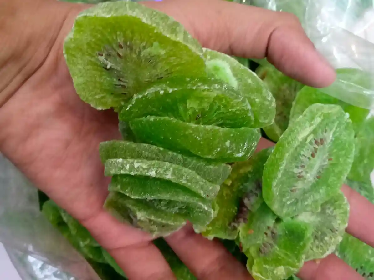 Kiwi slice in hand from gilgit baltistan