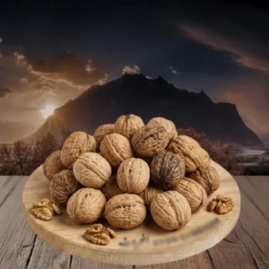 walnuts on the table with mountains and sun set in background