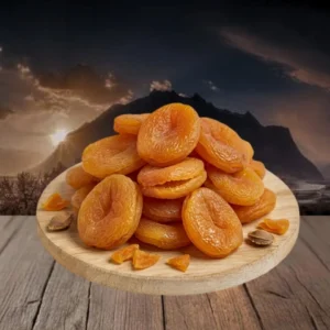 Dry apricot on the table with mountains and sunset in background